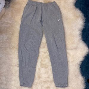 Nike Men’s Grey Sweatpants with cuffed bottoms.